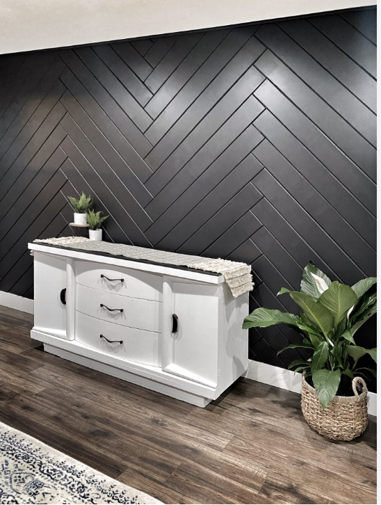 Shiplap Black Accent Wall with Herringbone Design using Wood Paneling with a more modern feel.