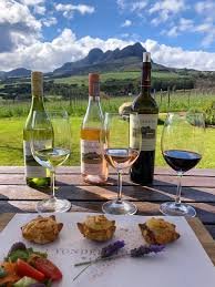 a table with wine and food on it