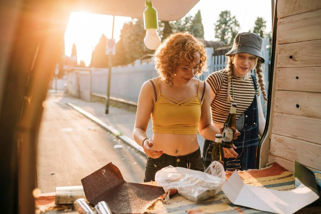 Two friends enjoying a sunny DIY project outdoors.