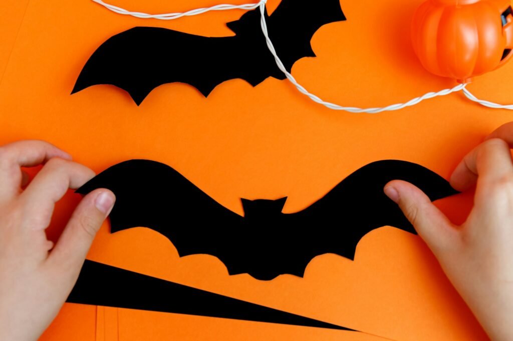 Little boy playing with spooky halloween decorations.