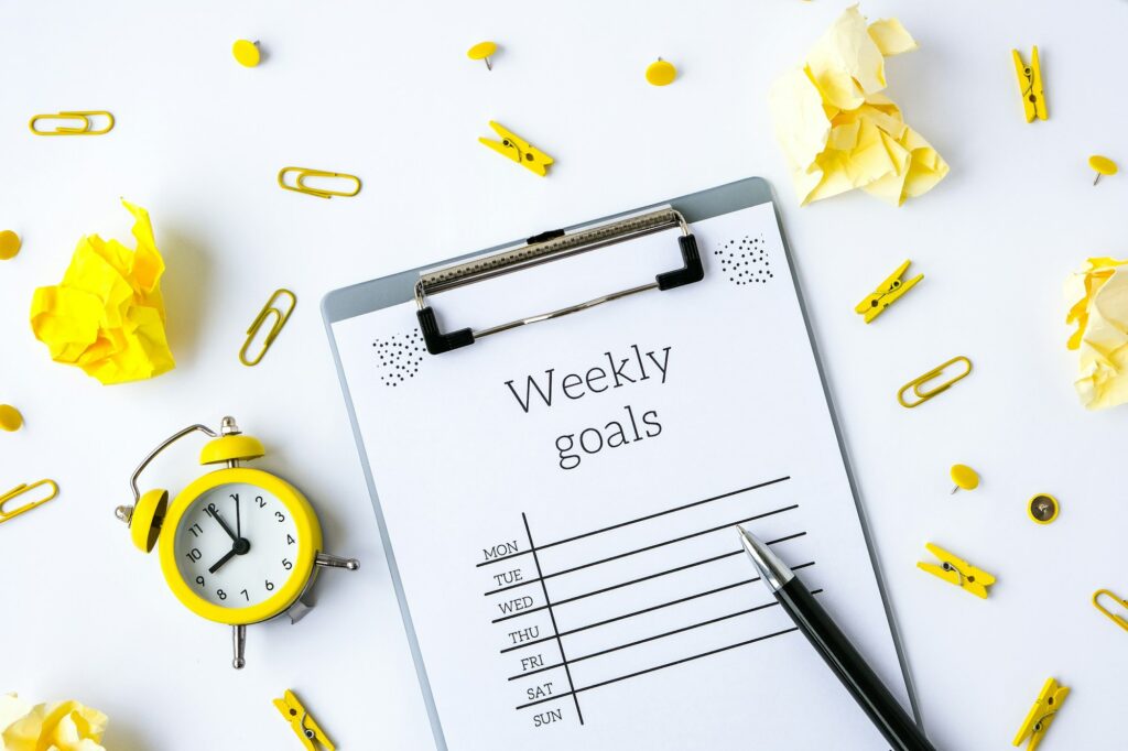 How to Balance Work and Family Life Without Losing Your Mind: A 7-Step Guide 3 Weekly goals planner on white background. Planning week to stay productive when working from home du