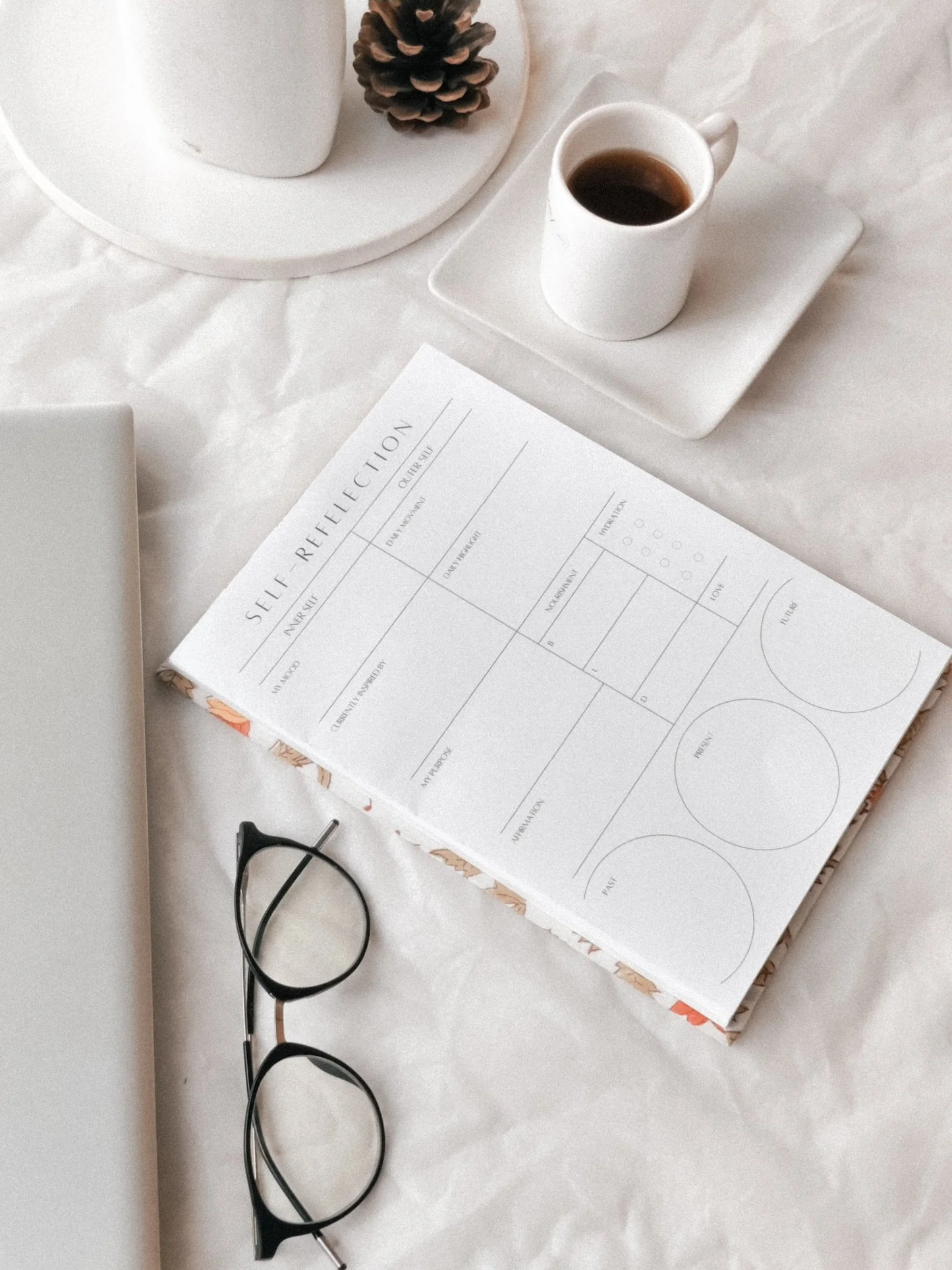 Notebook, coffee, glasses, minimalistic setup